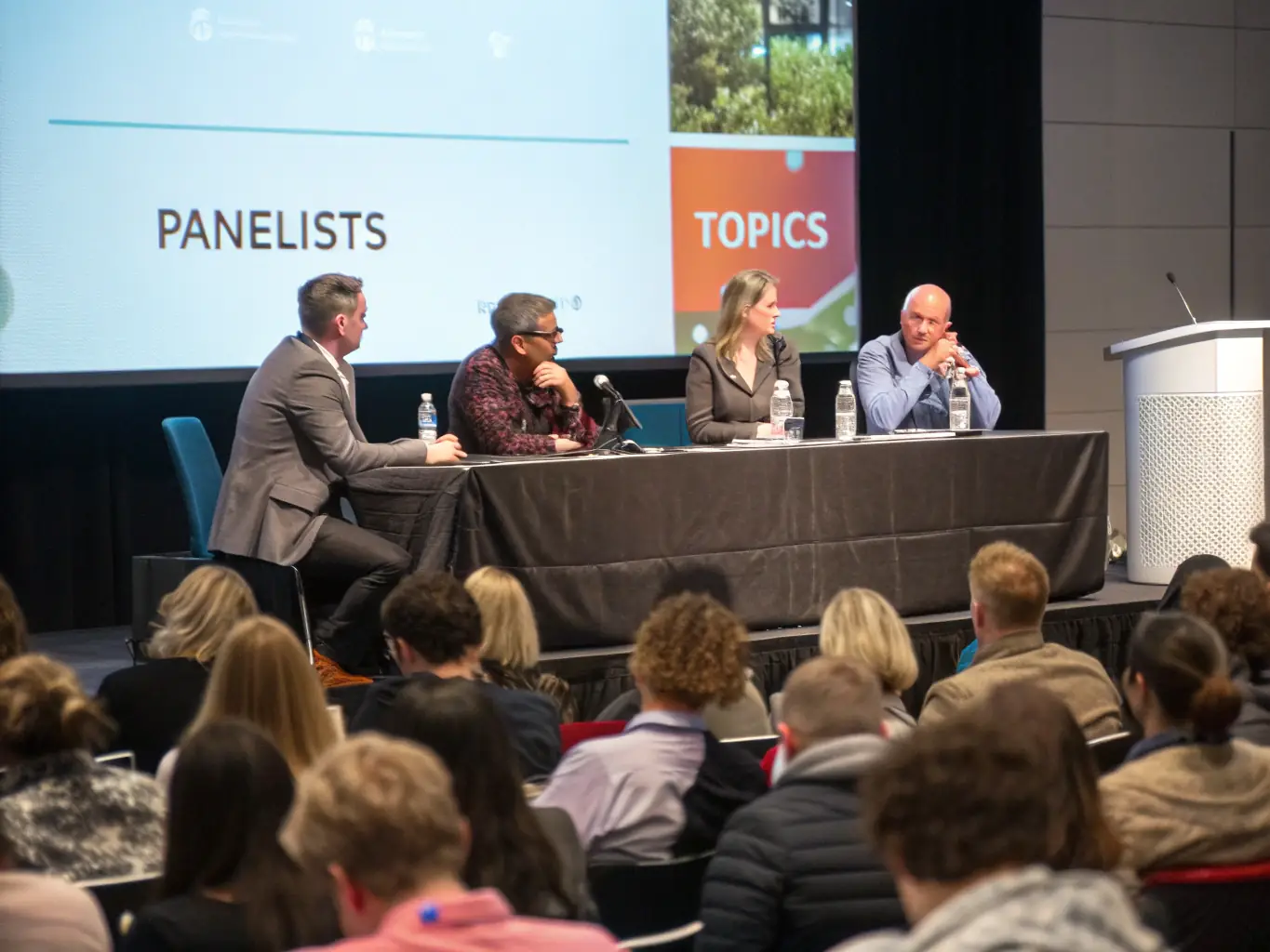 A photograph of a panel discussion at a BizConclave event, featuring diverse experts sharing their perspectives on corporate innovation.
